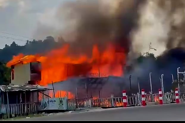 A fire burns at the wooden TupTup Resort on Patowar Tek beach in Inani, Ukhiya, Cox’s Bazar. The photo was taken on 17 October. 