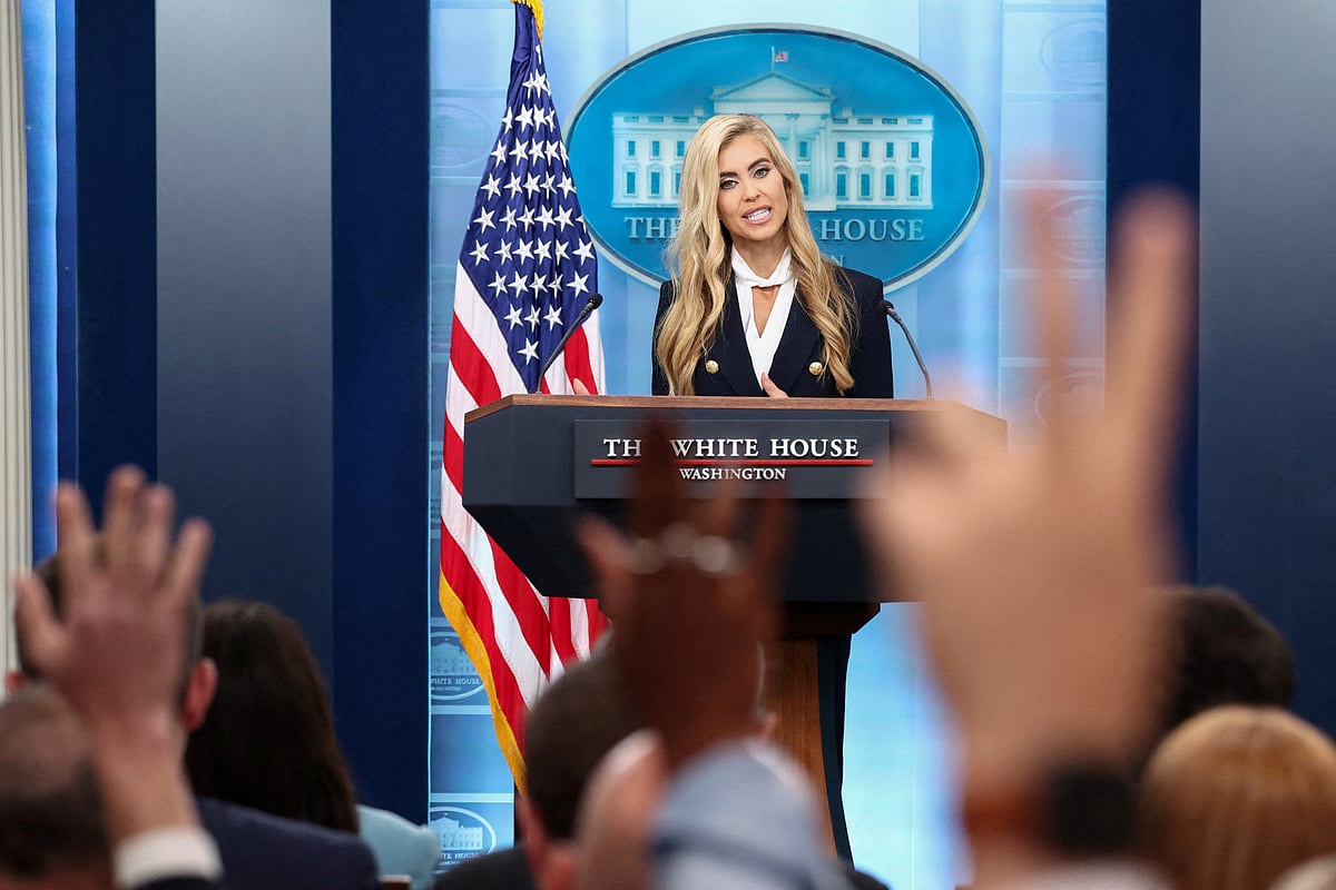 Reporters raise their hands to ask questions as the new White House Press Secretary Katie Zacharia holds her first press briefing at the White House in Washington, DC, US, 13 October 2026.