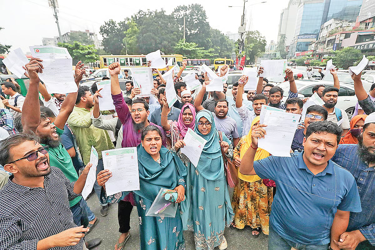 Angry candidates block roads to protest the suspension of the assistant upazila youth development officer recruitment examination.