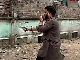 State Minister for Liberation War Affairs, Ishraque Hossain is seen with a firearm
