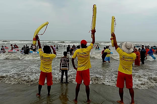 Tourists who go swimming at the beach in Cox's Bazar and get swept away are rescued by lifeguards.