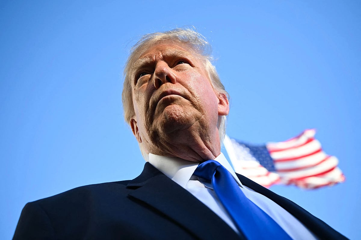 US President Donald Trump talks to the media before boarding Marine One on the South Lawn of the White House in Washington, DC, on 22 October, 2026. President Trump is travelling to Iowa to speak at a midterm campaign rally.