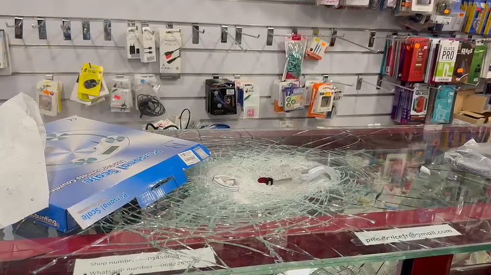 A Bangladeshi expatriate's shop damaged by vandalism and looting during protests in France.
