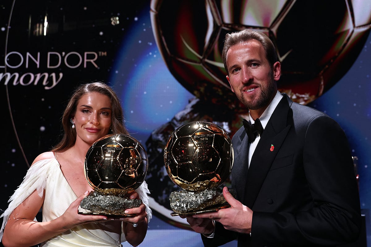 Spain and Barcelona midfielder Alexia Putellas and England and Bayern Munich forward Harry Kane pose with their trophies on stage after receiving their Ballon d’Or awards for the best female and male footballer during the 2026 Ballon d’Or France Football award ceremony at the Palladium Theatre in London on 26 October 2026
