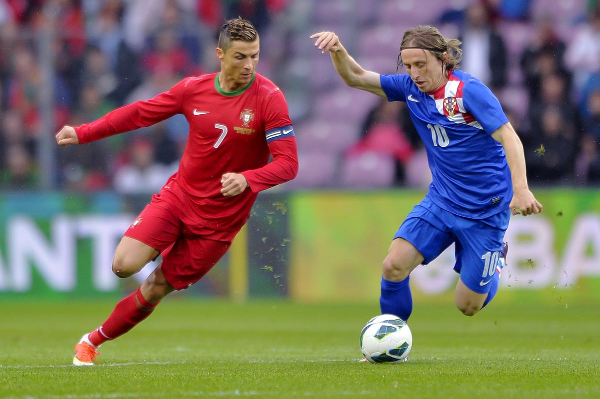 Portugal's forward Cristiano Ronaldo (L) vies with Croatia's midfielder Luka Modric during a FIFA World Cup 2014 friendly football match on June 10, 2013 in Geneva.