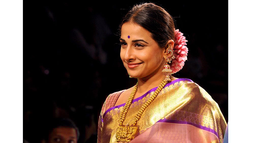 Bollywood actress Vidya Balan showcases a creation by designer Gaurang on the second day of the Lakme Fashion Week (LFW) summer/resort 2015 in Mumbai. Photo : AFP