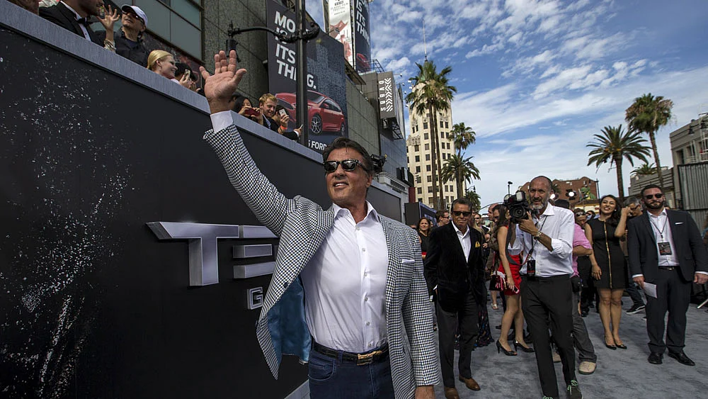 Actor Sylvester Stallone waves at the premiere of "Terminator Genisys" in Hollywood, California June 28, 2015.