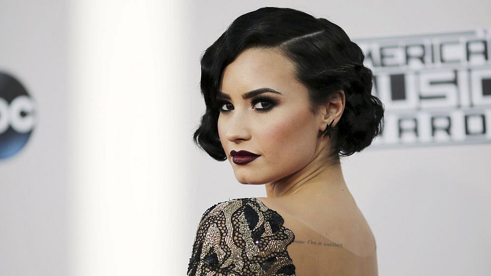 Singer Demi Lovato arrives at the 2015 American Music Awards in Los Angeles, California 22 November 2015.