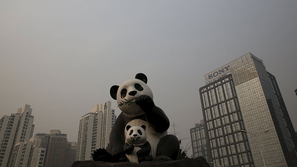 A polluted sky is seen behind statues of pandas on the second day after China`s capital Beijing issued its second ever `red alert` for air pollution, in Beijing, China, December 20, 2015.