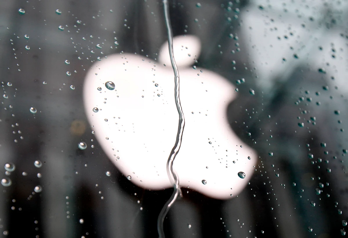The Apple Inc. logo is seen through raindrops on a window outside of its flagship store in New York in this file photo taken January 18, 2011.