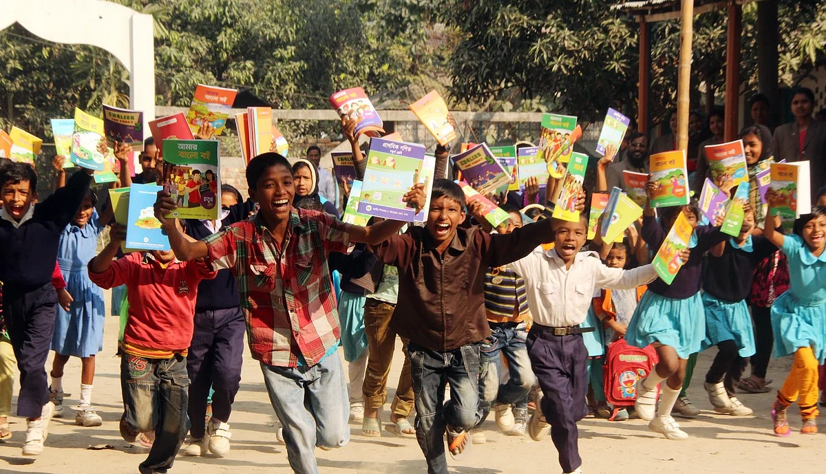 Fresher students of a Rangpur school burst into joy new books marking the ‘Textbook Festival Day’ on 1 January 2016