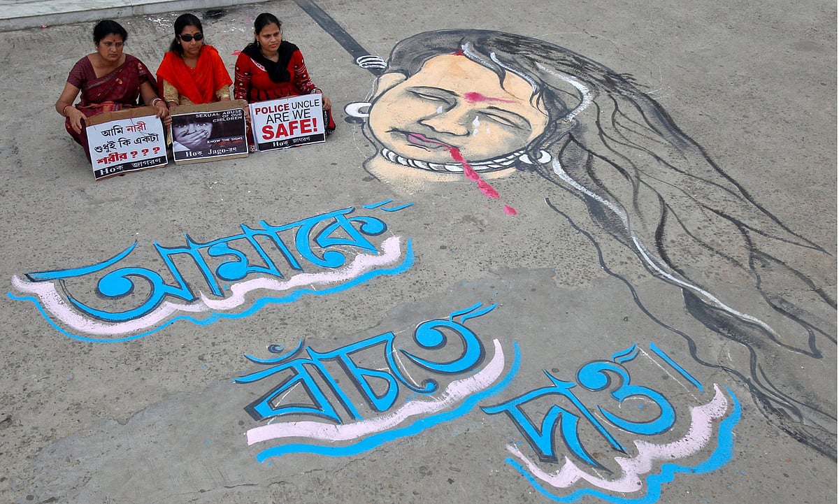 Demonstrator sit on the road seeking justice for rape victims