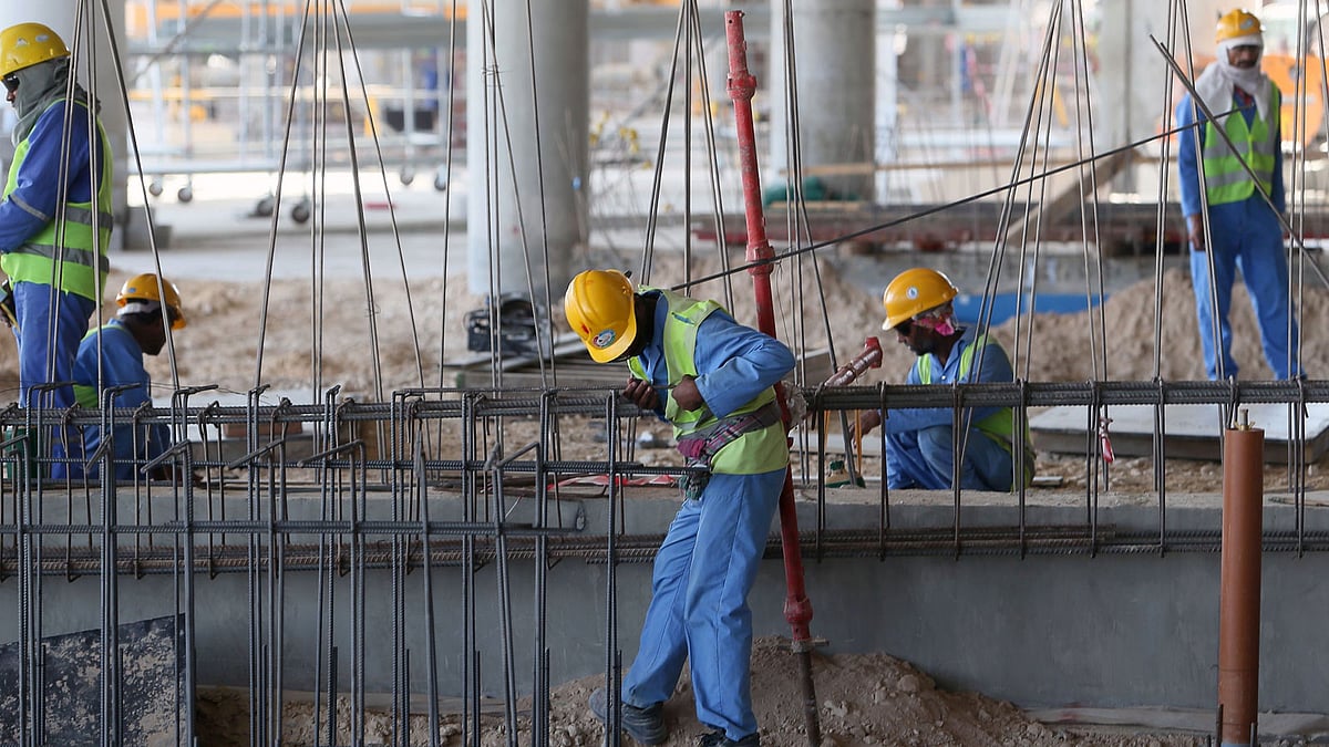 Migrant labourers working on a construction site in Qatar.