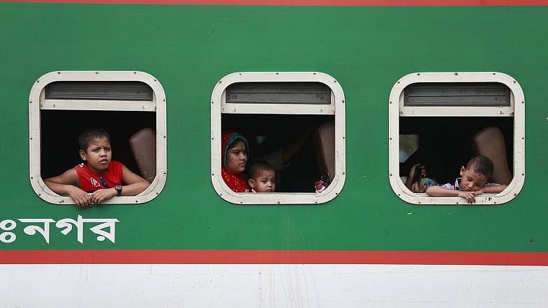 Eid holidaymakers are seen on a train at Airport Station, Dhaka