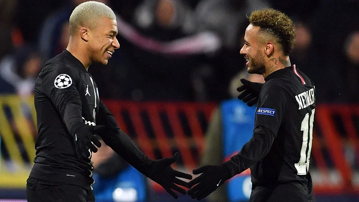 Paris Saint-Germain`s French forward Kylian Mbappe (L) celebrates with Paris Saint-Germain`s Brazilian forward Neymar after scoring a goal during the European Champions League football match Crvena Zvezda Belgrade vs Paris Saint-Germain (PSG) on December 11, 2018 at Rajko-Mitic stadium in Belgarde. AFP