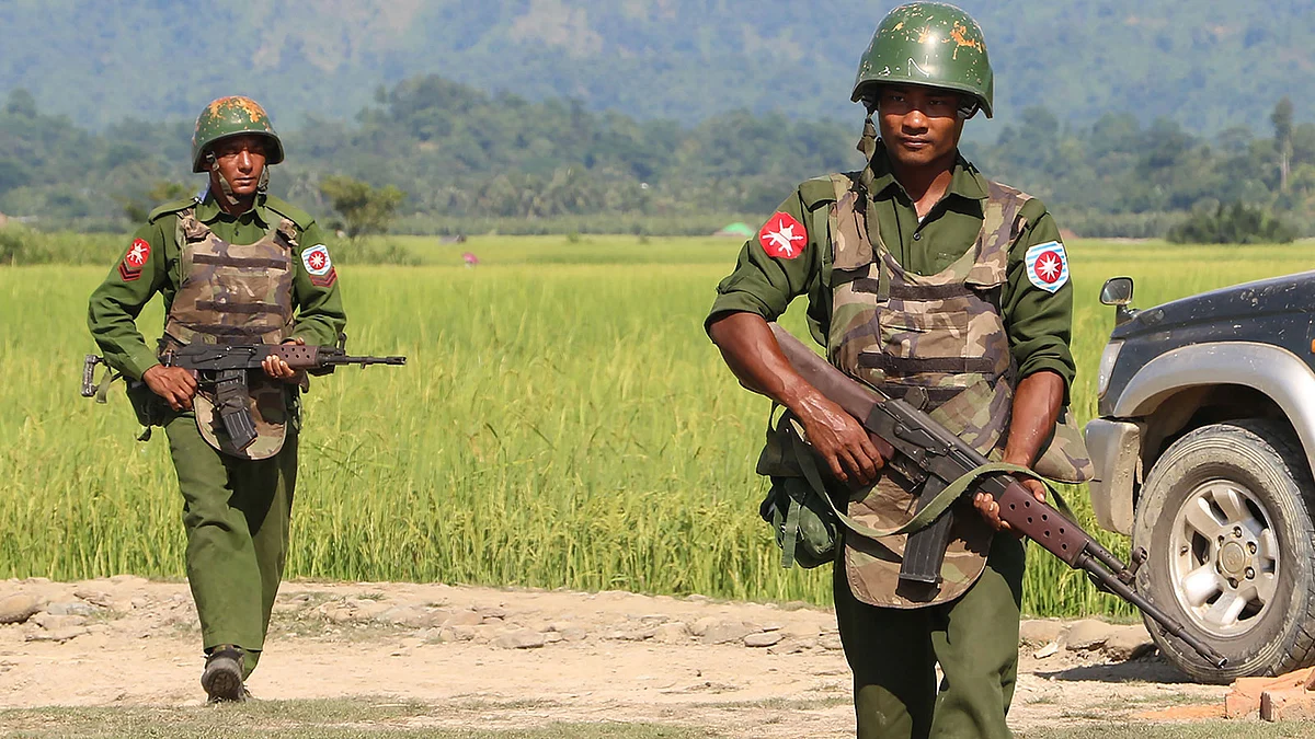 This file photo taken on 21 October, 2016 shows armed Myanmar army soldiers patrolling a village in Maungdaw located in Rakhine State as security operation continue following the 9 October, 2016 attacks by armed militants.