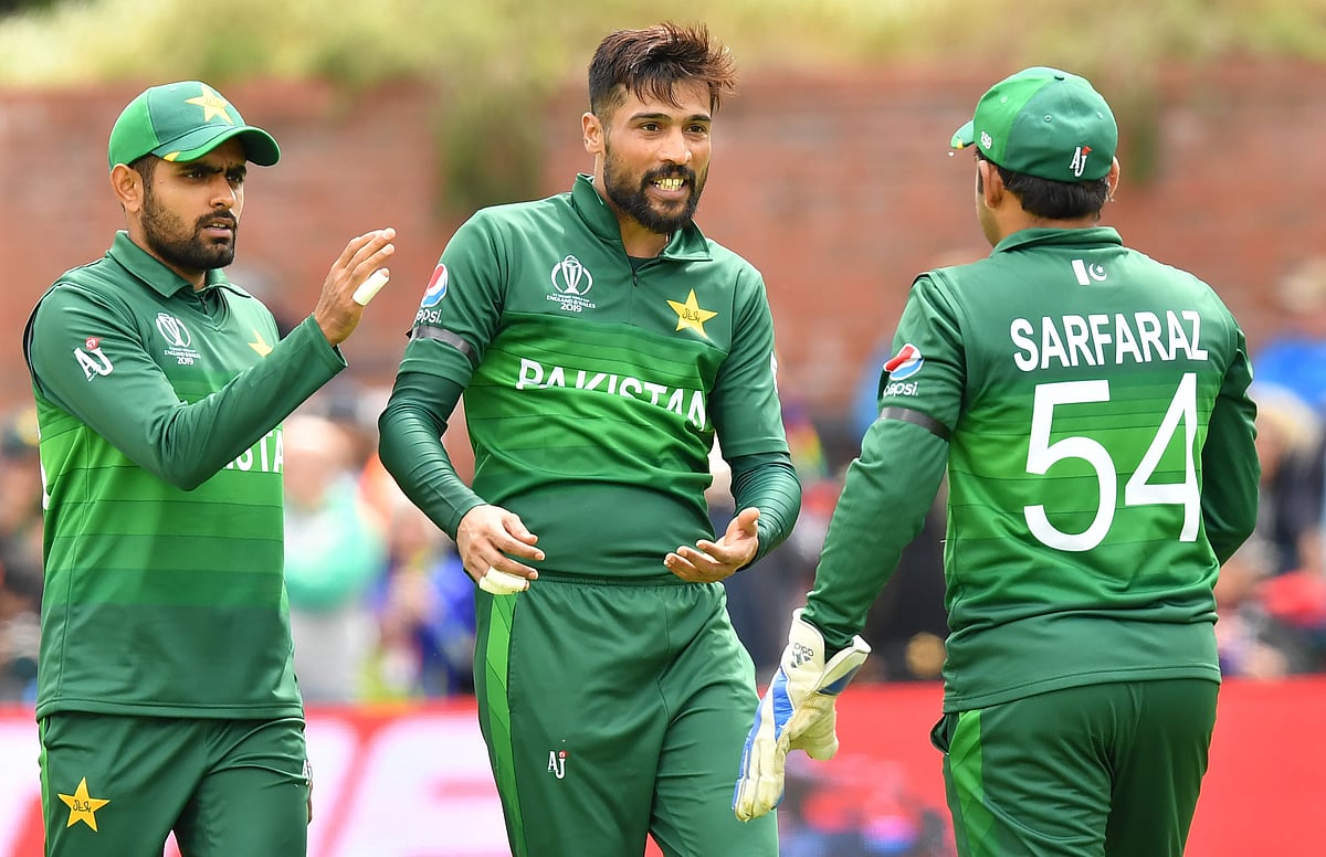 Pakistan's Mohammad Amir (C) celebrates with teammates after the dismissal of Australia's Alex Carey during the 2019 Cricket World Cup group stage match at The County Ground in Taunton, southwest England, on 12 June 2019