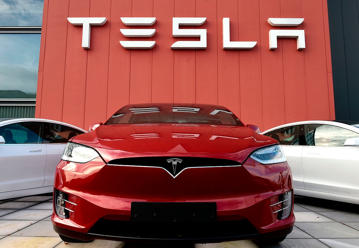 The logo marks the showroom and service center for the US automotive and energy company Tesla in Amsterdam on 23 October.