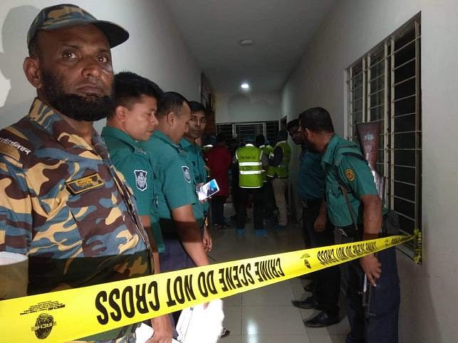 Police at a crime scene in Dhaka