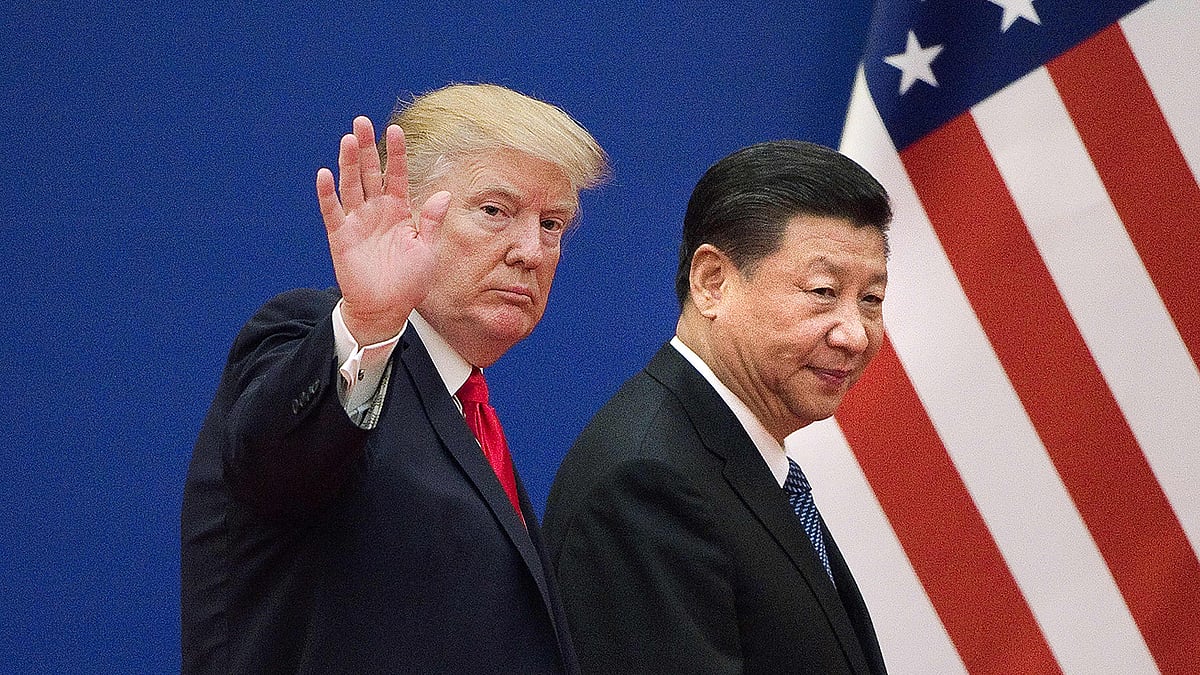 Tthis file photo taken on 9 November 2017 shows US president Donald Trump (L) and China`s president Xi Jinping leaving a business leaders event at the Great Hall of the People in Beijing. Photo: AFP